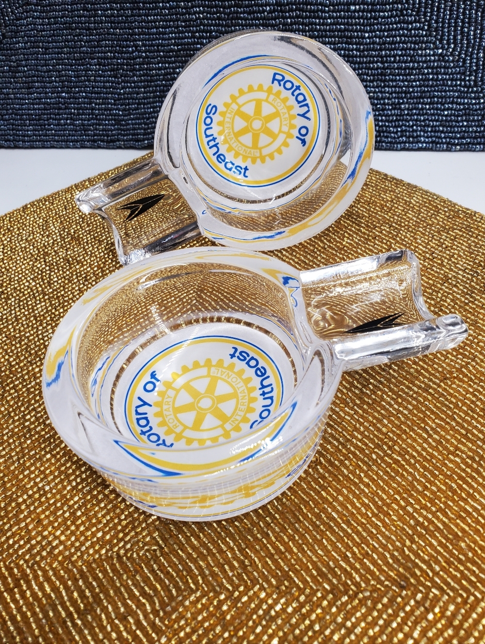 (2) Vintage glass ashtrays with the emblem of Rotary International Southeast Reg